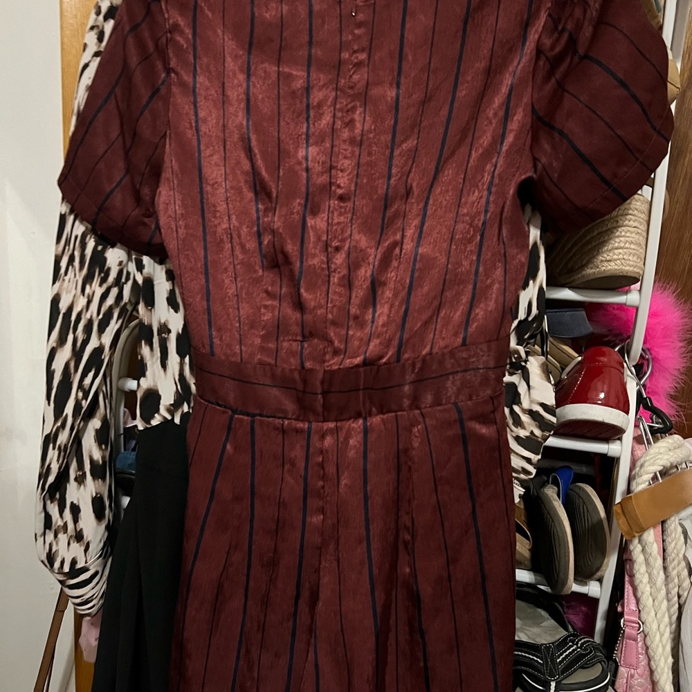 Beautiful brand new Jumpsuit. It’s a pretty Burgundy and Navy in color. - Picture 4 of 5